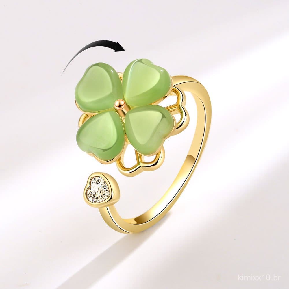 Novo anel feminino giratório de estilo europeu e americano com pedra olho de gato verde e design de trevo de quatro folh