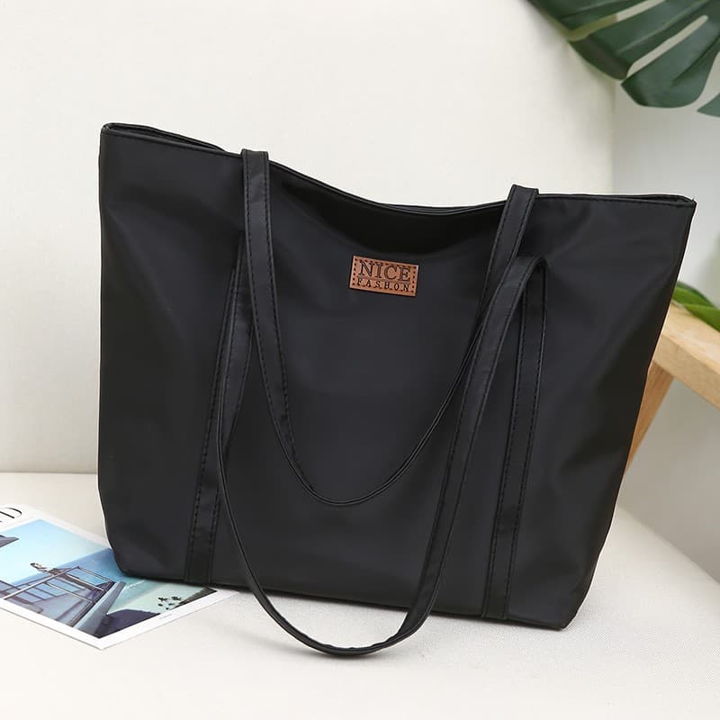Sacola feminina 2025 novo estilo moda Commuter um ombro grande saco portátil de grande capacidade náilon Oxford pano lon