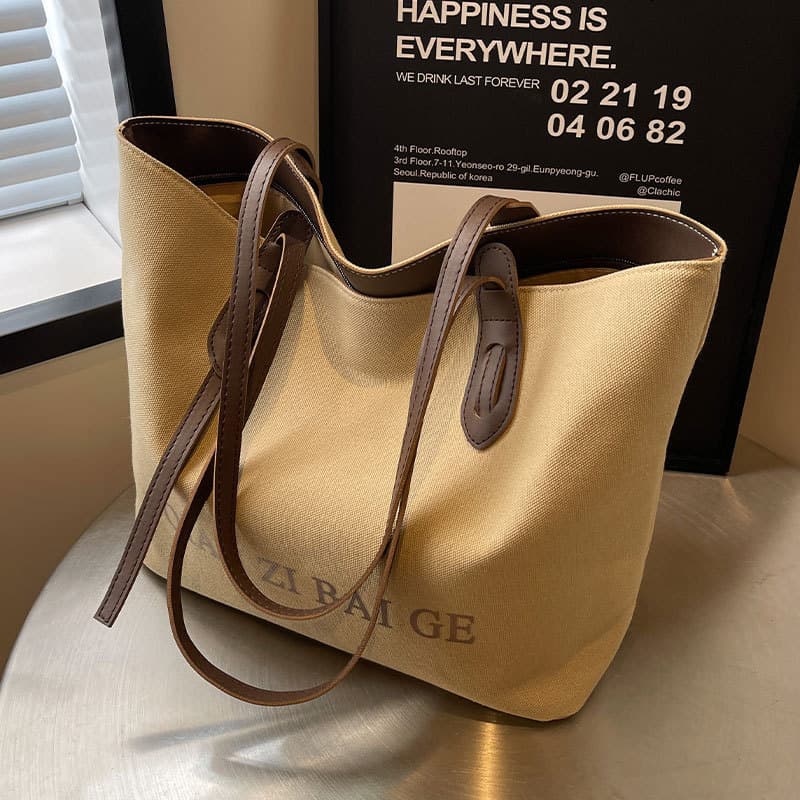 Bolsa de lona Casual de grande capacidade feminina 2026 novo estilo simples nicho Commuter sacola estudantes universitár