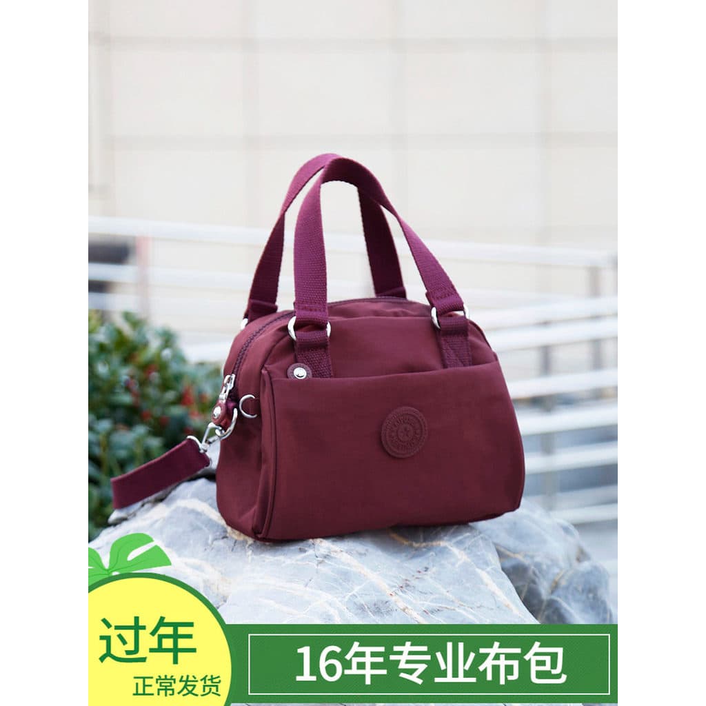 2026 novo estilo portátil mãe bolsa Casual mensageiro bolsa de ombro leve feminina All-Match lona mensageiro mãe saco