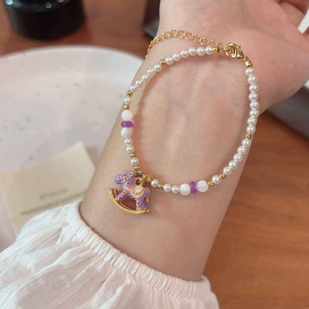 [Estoque pronto] 2025 novo estilo roxo pingente balanço trojan pérola pulseira feminina High-End sentimento um estilo du