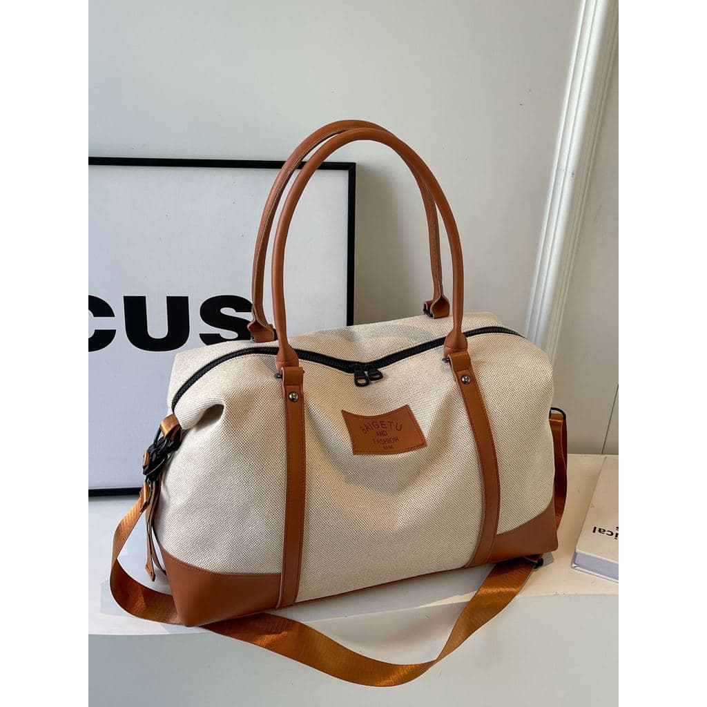 Bolsa de viagem 2025 novo estilo bolsa grande capacidade curta distância passeio viagem portátil saco Designer lona femi