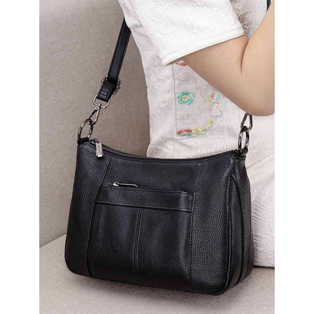 Bolsa de couro genuíno feminina bolsa mãe de meia-idade leve 2026 novo estilo moda couro macio grande capacidade senhora