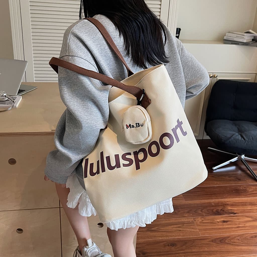 Bolsa de lona de arte simples carta 2025 Casual novo estilo grande capacidade viagem estudante classe Commuter bolsa de