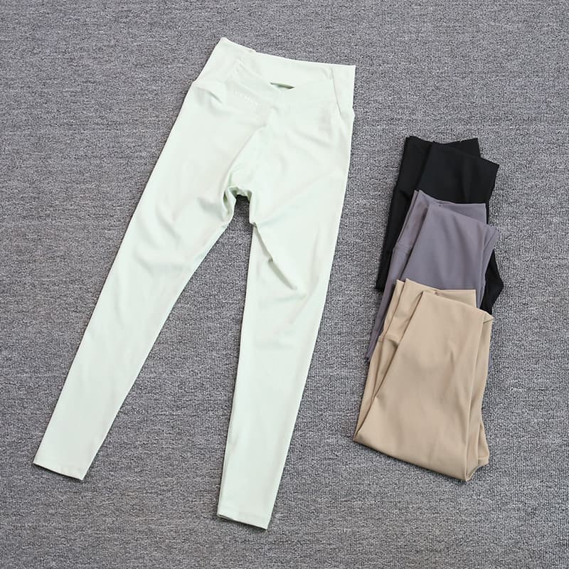 Calças de Yoga femininas cintura alta Hip Lift primavera outono estiramento barriga estreitando volta oco carta Leggings