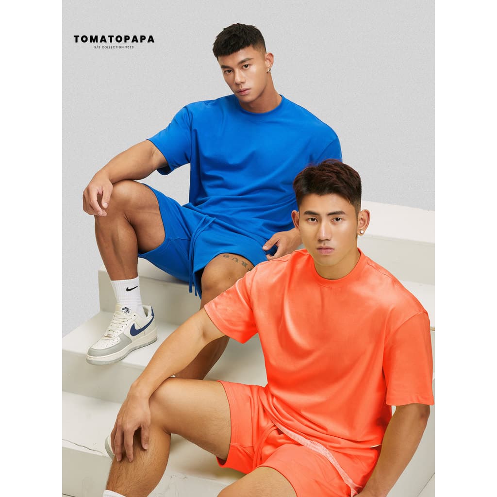 TOMATOPA Camiseta de manga curta com gola redonda masculina solta ombro caído respirável camiseta cor sólida