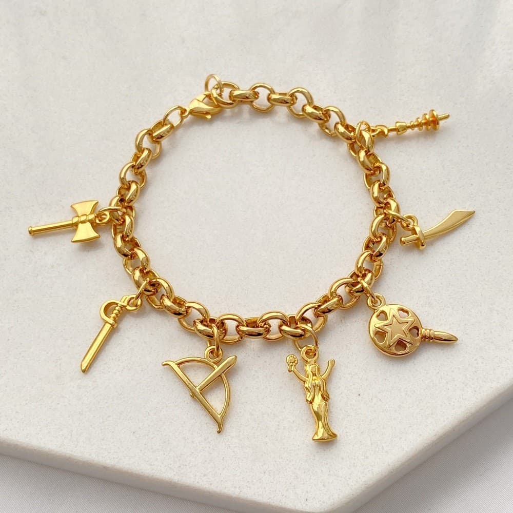 Pulseira com pingentes Sete Orixás: Oxalá, Iemanja, Oxossi, Ogun, Xangô, Iançã, Oxum folheada a ouro 18k