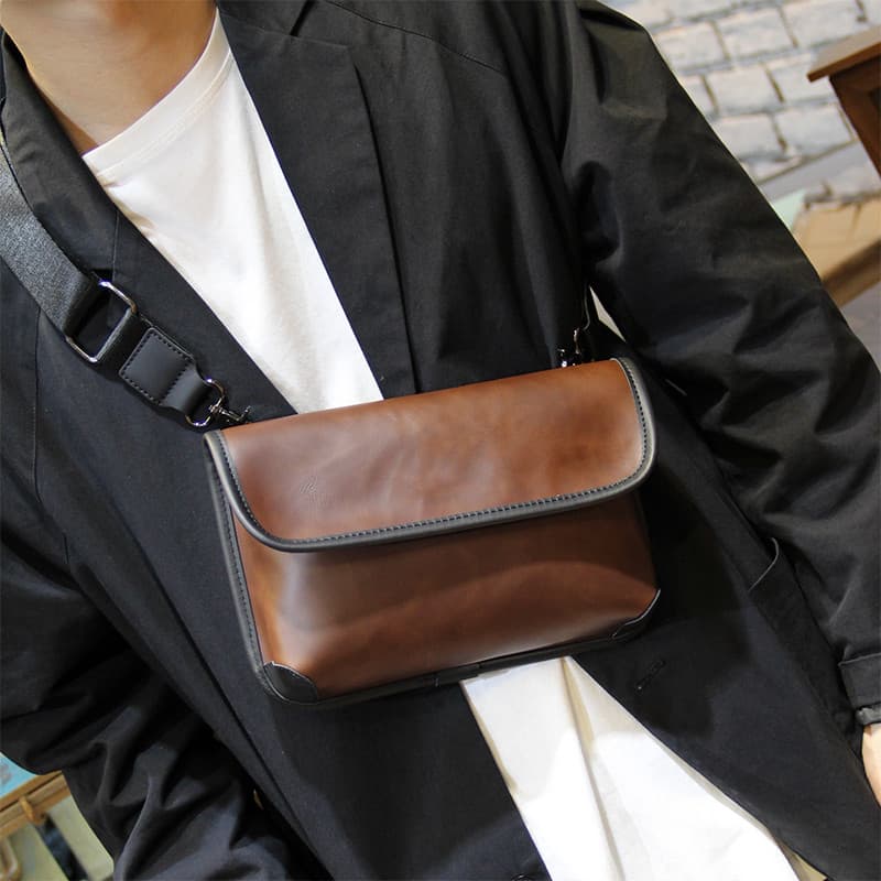 Moda bolsa de ombro bolsa mensageiro masculina Casual versão coreana bolsa mensageiro estudante rua pequena bolsa 2026 n