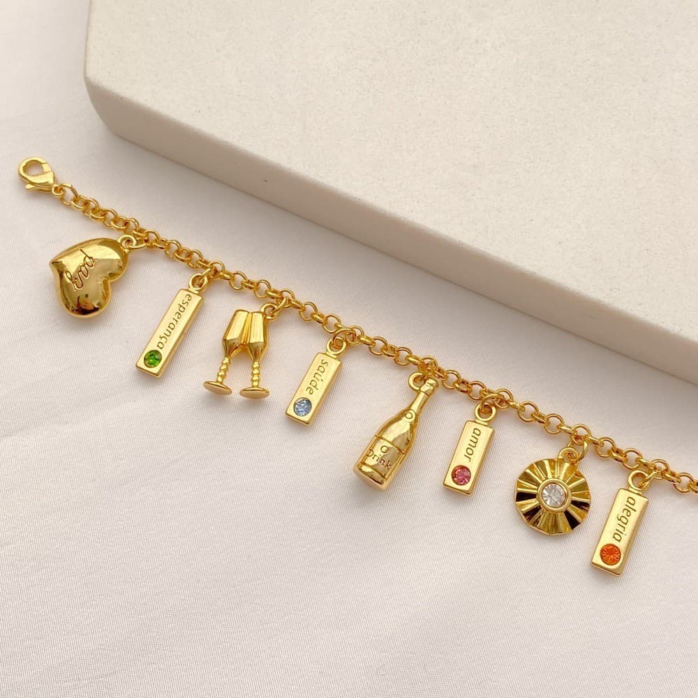 Pulseira dos Desejos Espumante, Taças, Ponto de Luz, Coração e "Paz, Esperança, Saúde, Amor e Alegria" folheada a ouro