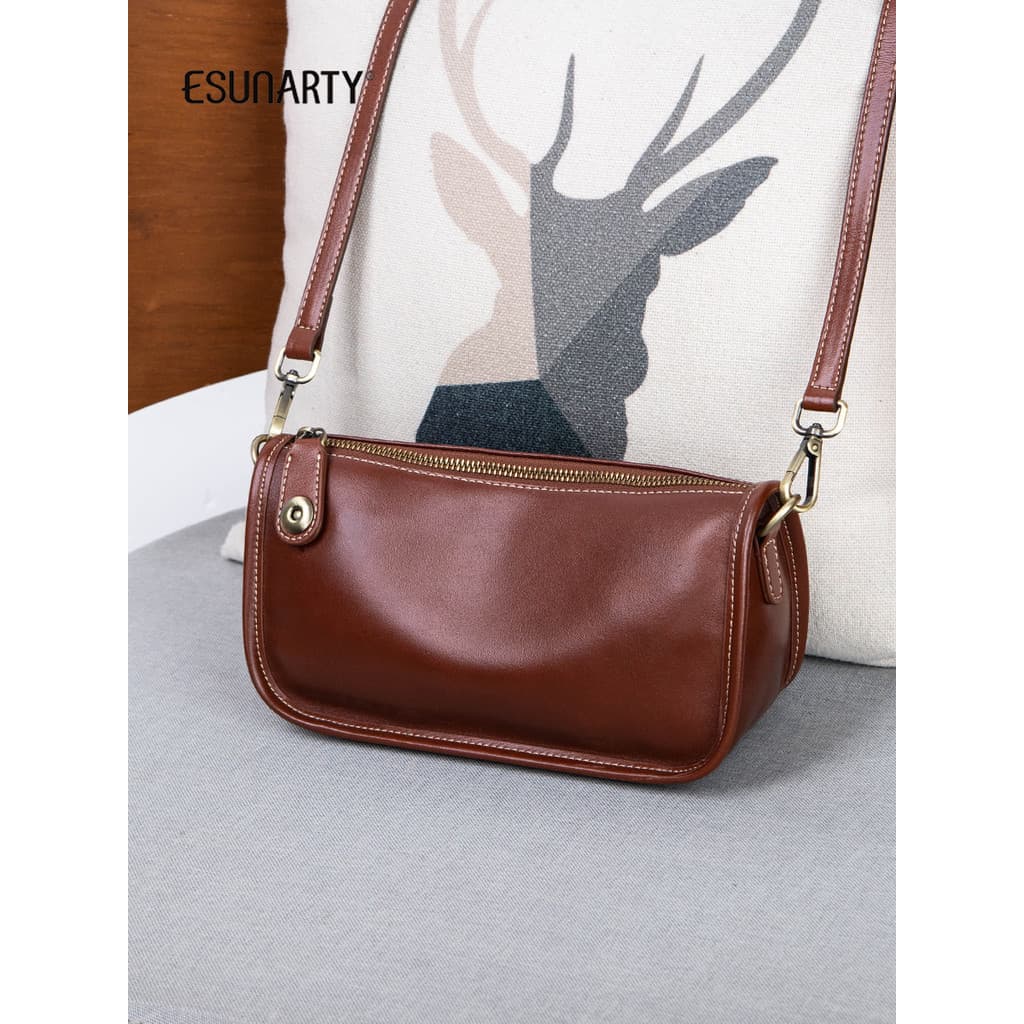 Bolsa pequena feminina 2025 novo estilo de couro genuíno Design nicho banda larga couro macio bolsa mensageiro de ombro