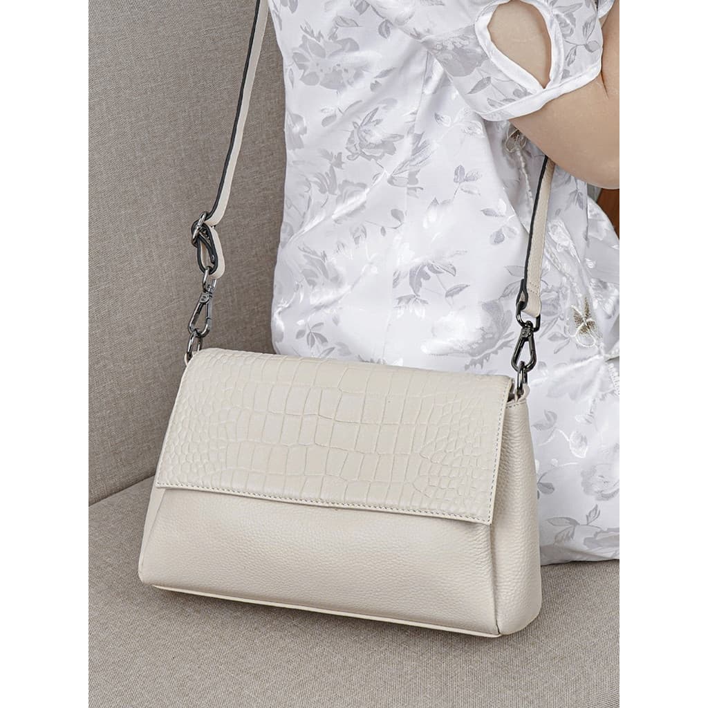 Bolsa feminina de couro genuíno 2025 novo estilo moda portátil mãe saco de couro macio Multi-compartimento saco do mensa