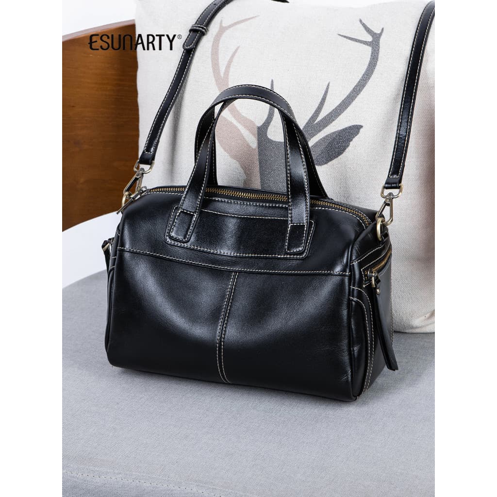 Bolsa feminina mensageiro 2025 novo estilo de couro genuíno portátil Boston bolsa feminina High-End sentimento banda lar