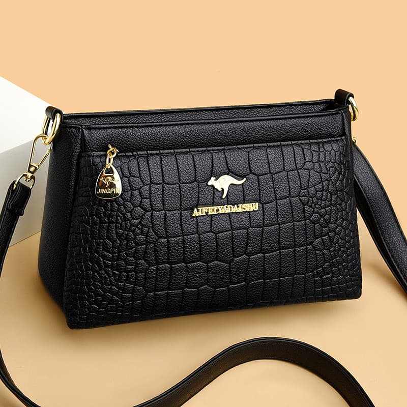 Marca bolsa de couro genuíno feminina 2026 novo estilo na moda mãe de meia-idade saco All-Match couro macio ombro mensag