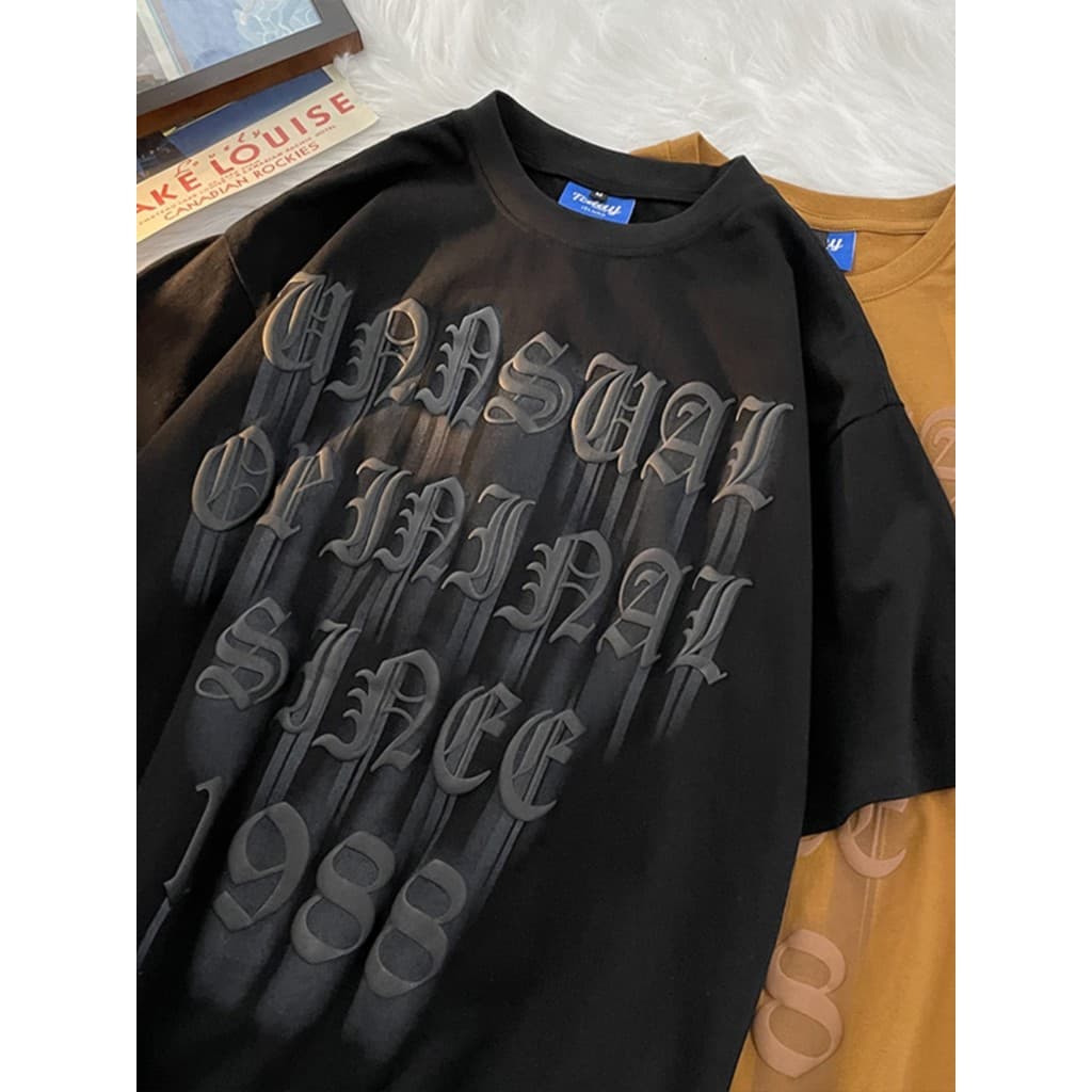 Espuma impressa camiseta de manga curta solta americana High Street casal camiseta masculina verão na moda rufião bonito