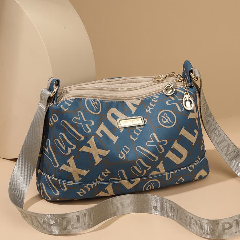 Bolsa feminina 2026 novo estilo senhoras de meia-idade Casual bolsa mensageiro de um ombro Multi-compartimento