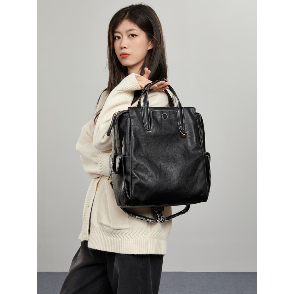 Grande capacidade das mulheres dos homens trabalhando Commuter mochila couro preto 2026 novo estilo mochila 53cm computa