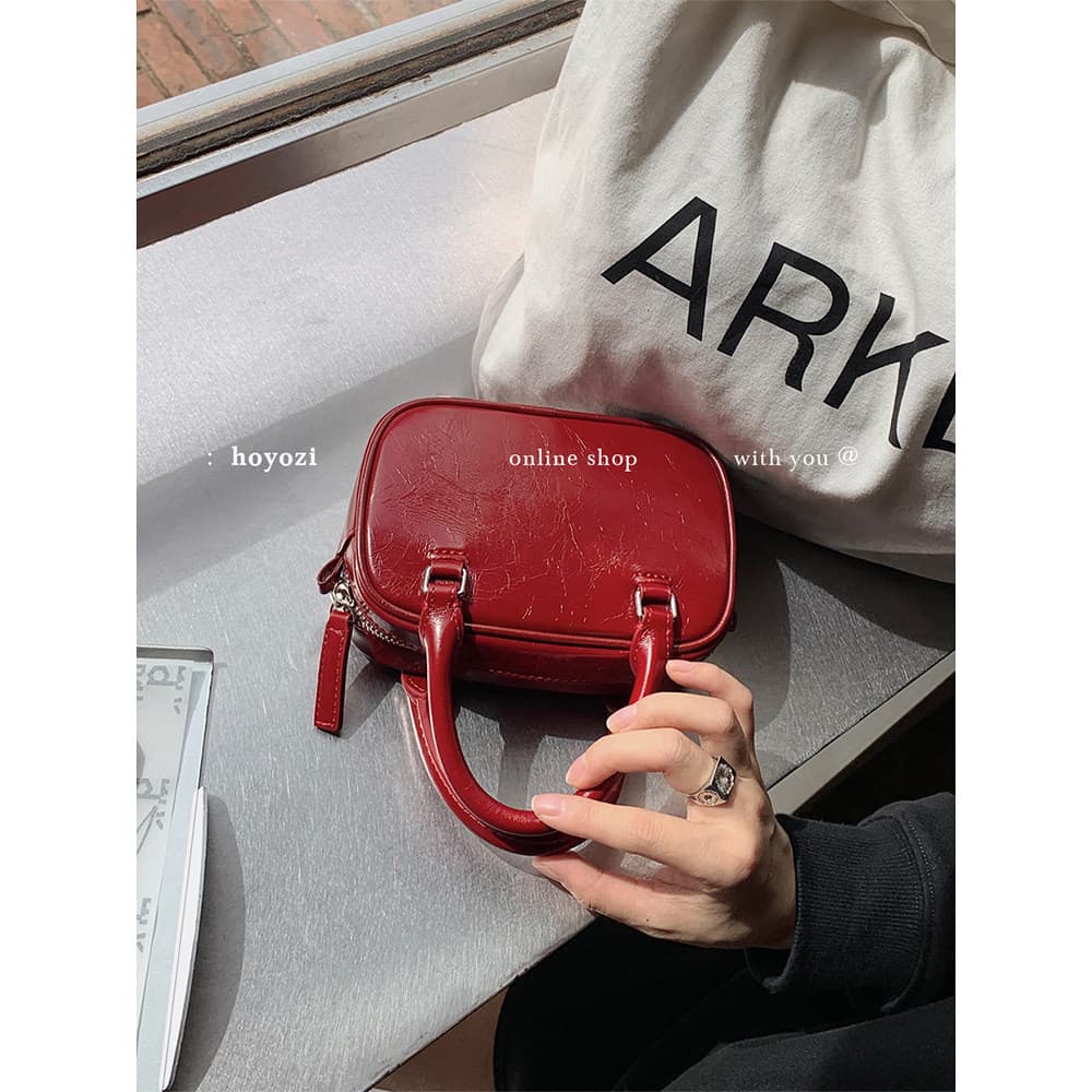 [Bolsa Xiaoyoujia] HOYOZI Bolsa vermelha de couro de primeira camada para celular pequena bolsa feminina 2026 novo estil