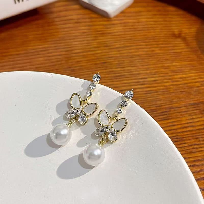 Arco prata agulha High-End temperamento nicho Design brincos luz luxo novo estilo brincos de pérola feminino