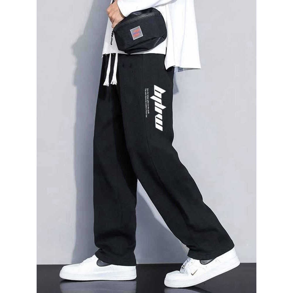 Calças esportivas primavera estilo masculino 2025 solto novo estilo em linha reta juventude Casual All-Match na moda per
