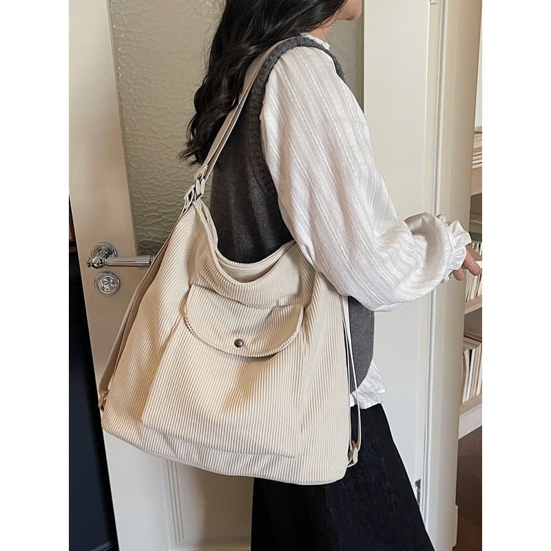 Estilo simples grande capacidade sacola feminina bolsa de ombro mensageiro Commuter All-Match veludo 2026 novo estilo