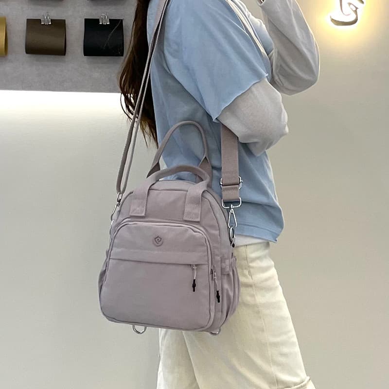 2025 novo estilo impermeável náilon Oxford pano mochila feminina Casual multifuncional de um ombro saco do mensageiro po