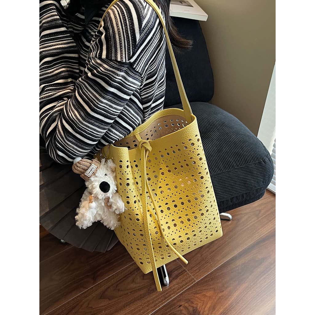 bolsa transversal feminino bolsa femenina Verão Popular oco grande saco feminino 2026 novo estilo moda couro macio Commu