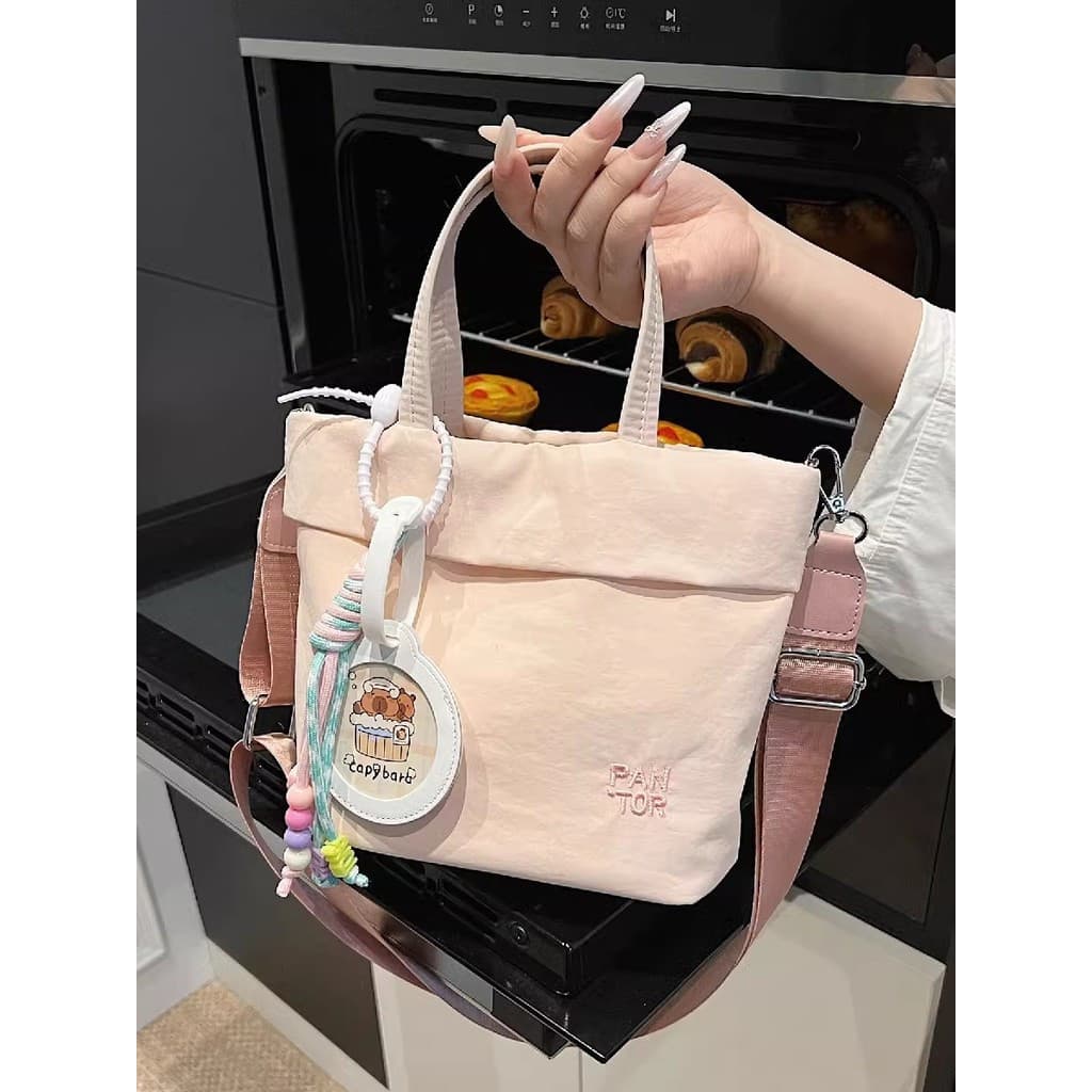 Estilo coreano plissado mão-transporte pano de náilon pequeno saco feminino 2026 novo estilo verão cor sólida simples cr