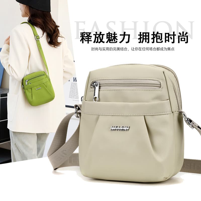 Bolsa pequena pequena feminina primavera novo estilo tecido Oxford pequena bolsa mensageiro de três camadas para celular