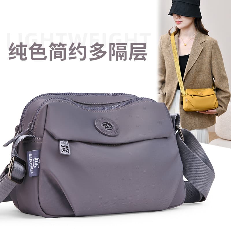 2026 Novo estilo Casual estilo simples feminino bolsa mensageiro de um ombro multicamadas de grande capacidade leve All-