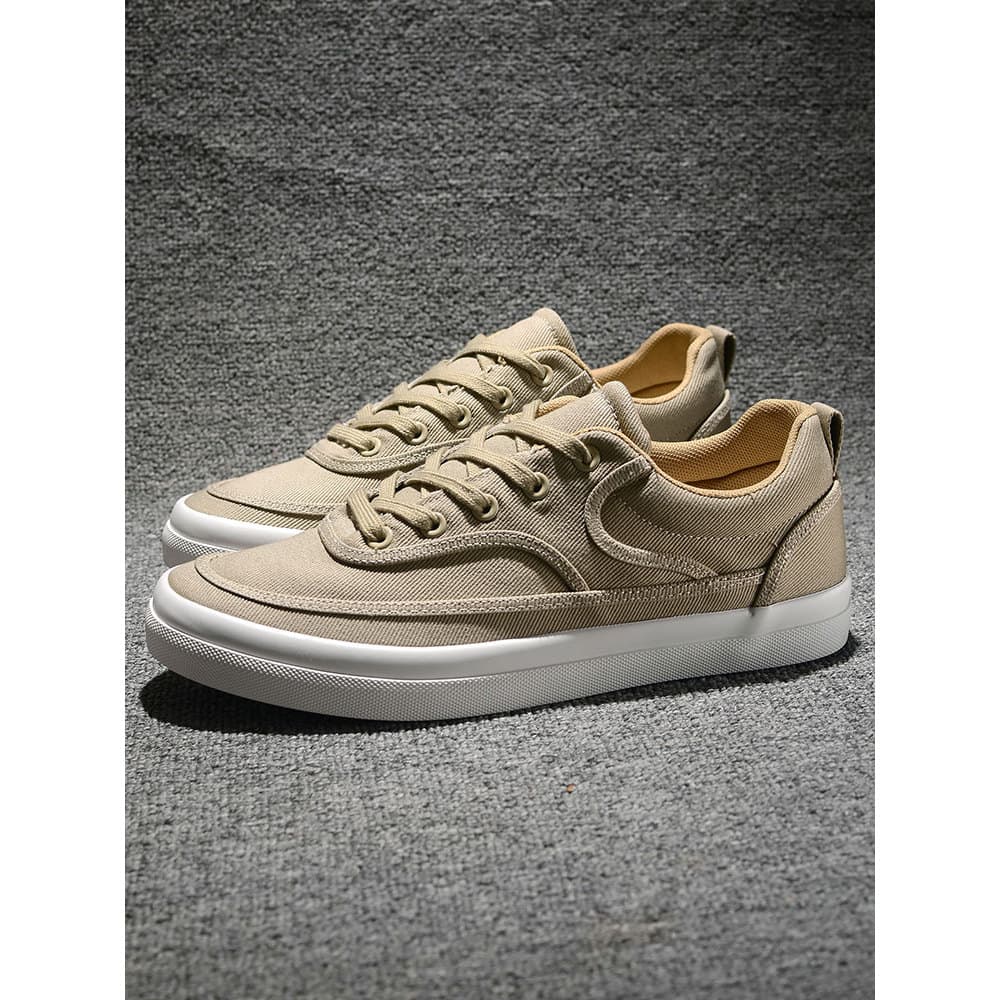 Sapatos masculinos britânicos 2025 primavera outono respirável baixo-topo rendas sapatos de lona sola macia tênis casuai