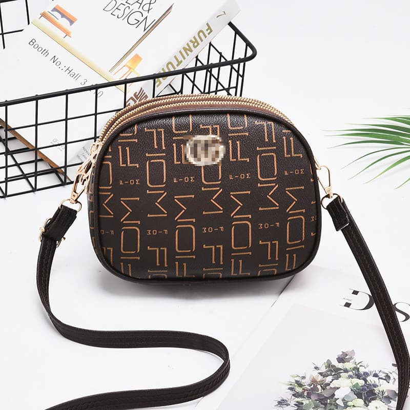 2026 novo estilo bolsa feminina moda mensageiro bolsa de ombro na moda senhoras pequena bolsa redonda Mini pequeno saco