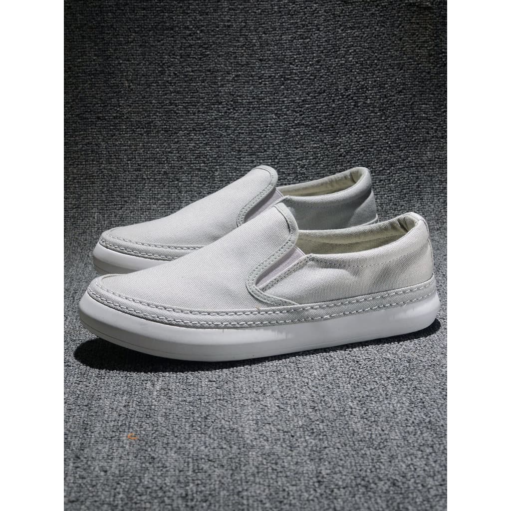 Sapatos masculinos 2026 primavera outono novo estilo sapatos de lona deslizamento-em sapatos preguiçosos tênis casuais d