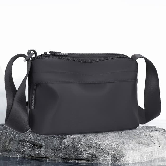 Novo estilo bolsa mensageiro masculina bolsa de ombro simples All-Match passeio masculino portátil pequeno saco portátil