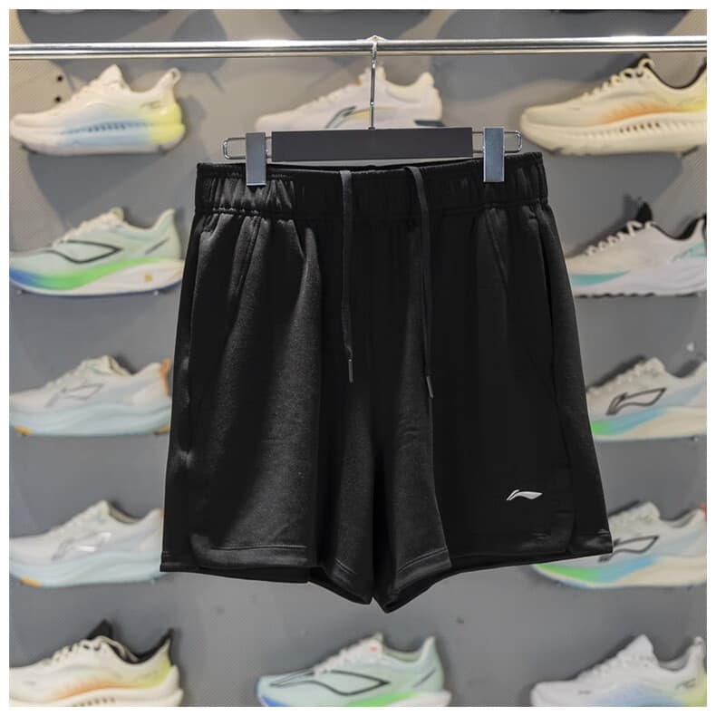 Li Ning Shorts esportivos femininos 2025 verão respirável corrida série Fitness moletom solto AKSV438