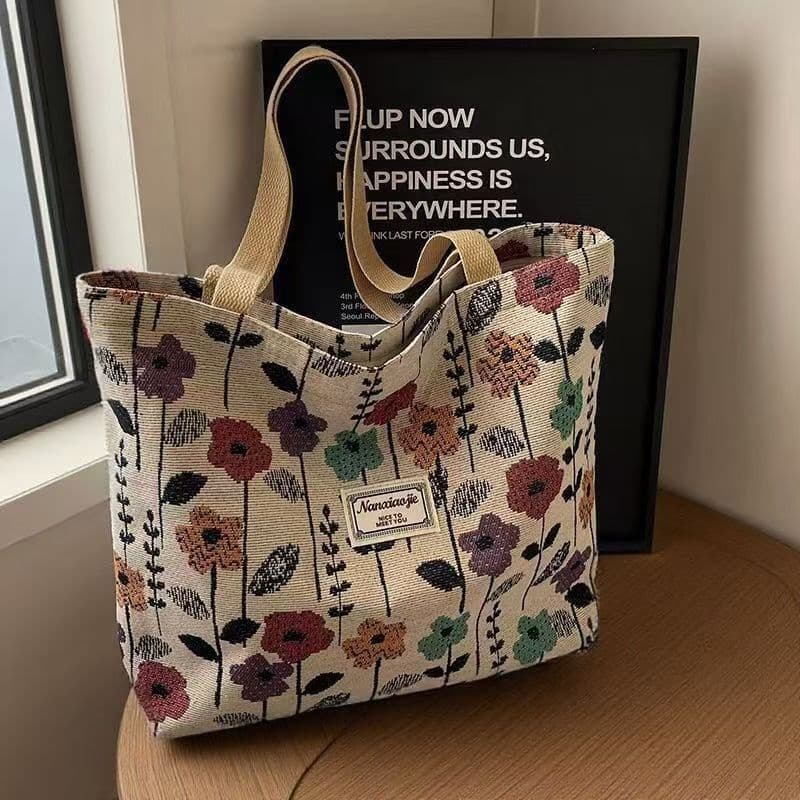 Bolsa de ombro de nicho de grande capacidade feminina 2025 novo estilo bolsa de lona bolsa de classe Commuter