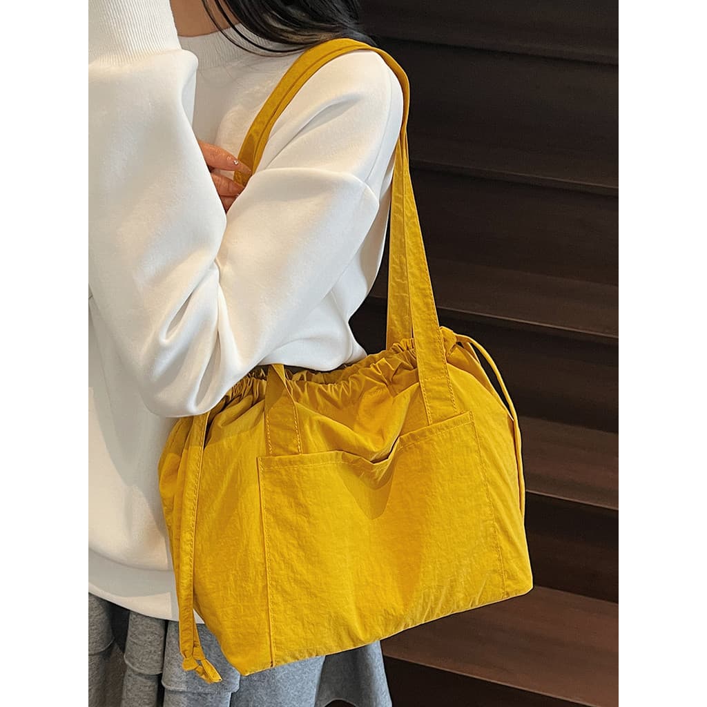 Casual All-Match Ultra-leve bolsa de ombro feminina 2025 novo estilo grande capacidade mamãe saco portátil lona Commu