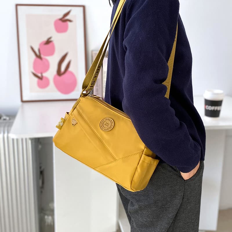 Moda nicho mensageiro saco feminino pano de náilon senhoras mochila Casual leve ombro pequena bolsa de ombro Multi-camad