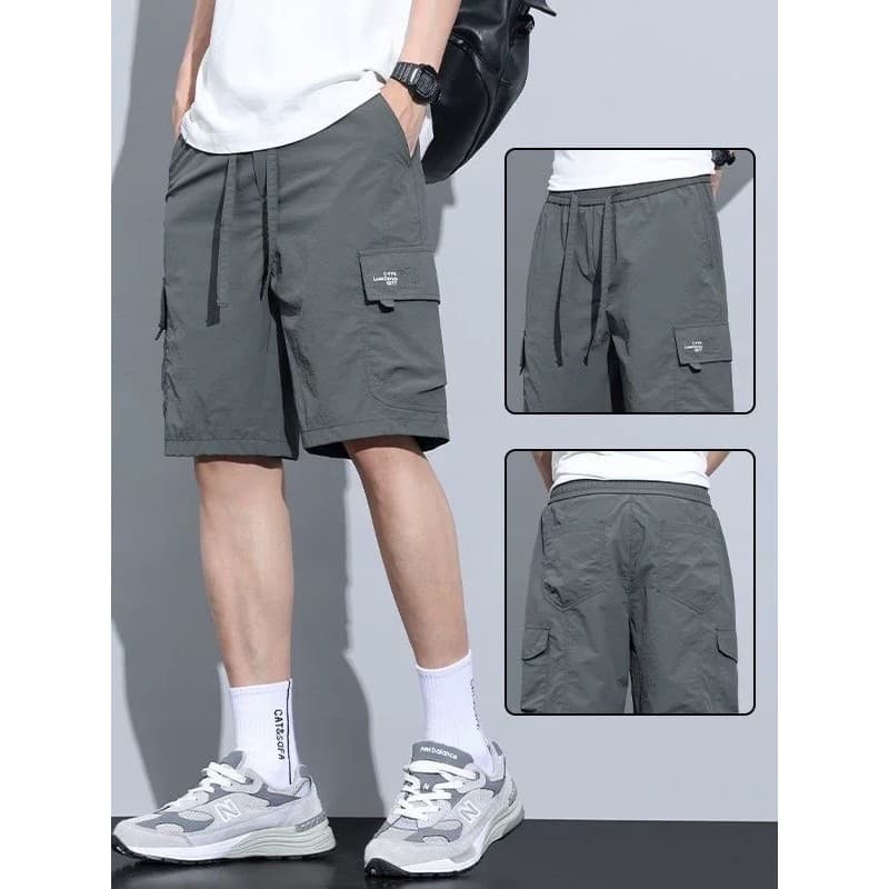 Verão de secagem rápida Multi-bolso estilo fino cor sólida simples solto macacão Shorts masculino cinco pontos