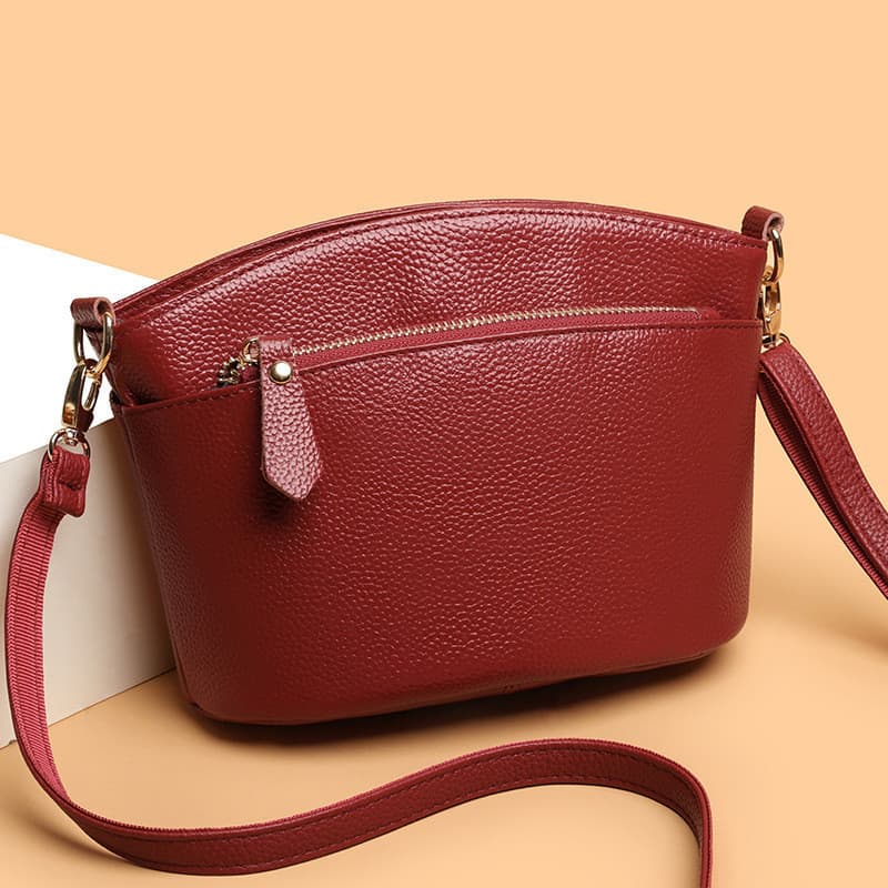 Bolsa Feminina Couro Legitimo Transversal Mao Ombro Tres Ziperes Divisoria Formato Meia Lua Pequena 2026