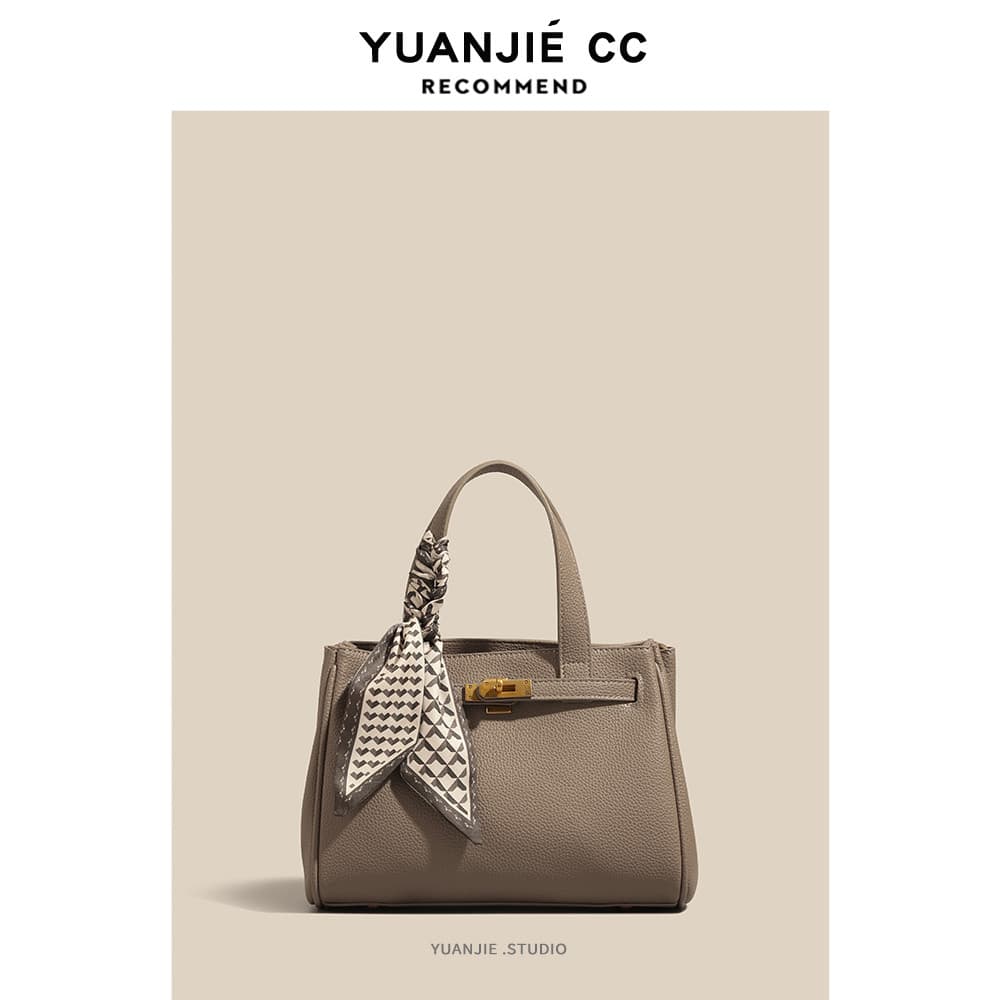 Bolsa feminina de couro genuíno 2026 novo estilo leve luxo bolsa feminina nicho extravagante bolsa mãe livre bolsa de om