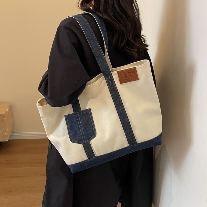 2026 Novo estilo meninas grande capacidade Casual Commuter costura bolsa de lona jeans de um ombro