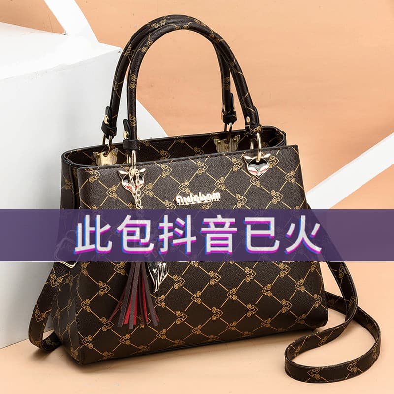 Bolsa grande 2026 novo estilo moda feminina bolsa de couro bolsa mãe meia-idade grande capacidade um ombro