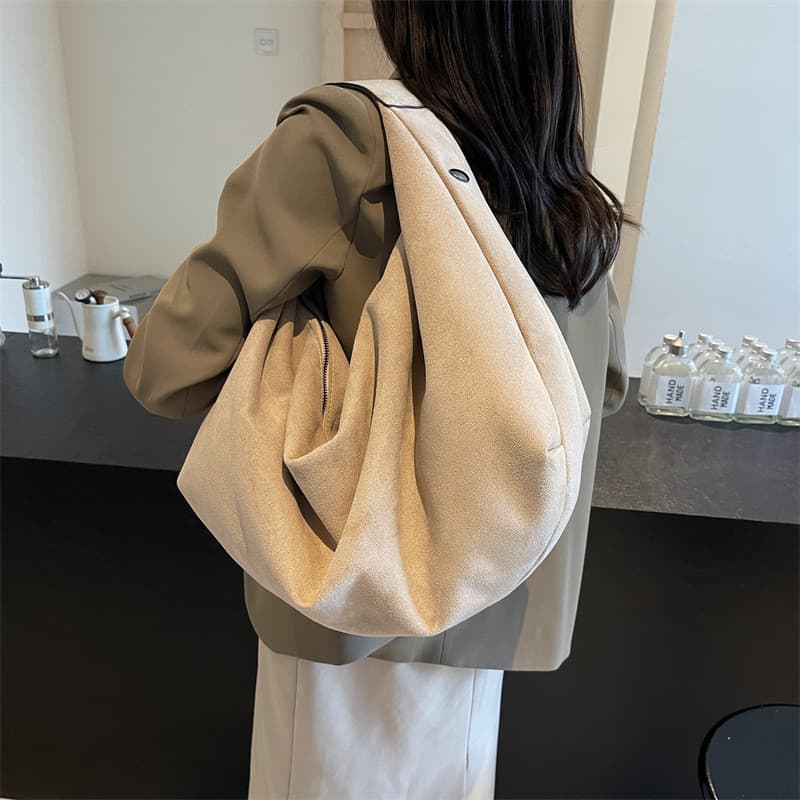 Sacola de camurça Bolsa feminina 2026 sensação solta bolsa de ombro de grande capacidade