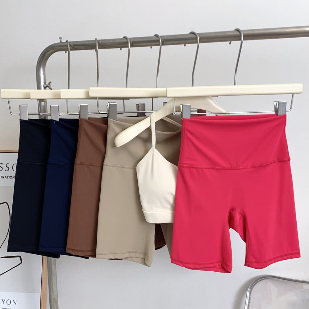 Fitness Shorts de três pontos pele-amigável nu Yoga calças magras de alta elasticidade pêssego Hip-Lifting ciclismo Anti