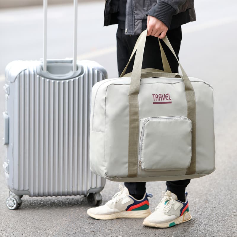 Bolsa de viagem feminina de grande capacidade, bolsa de bagagem de mão esperando por produção, bolsa de armazenamento de