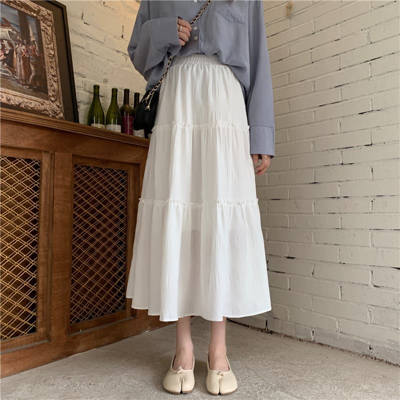Estudante moda branco bolo saia feminina primavera 2026 novo estilo saia de cintura alta comprimento médio a linha guard
