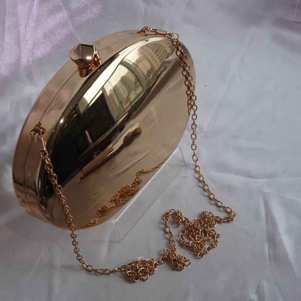 Bolsa Clutch Metálica Espelhada em Formato de Oval para Festas com Elegância e Estilo