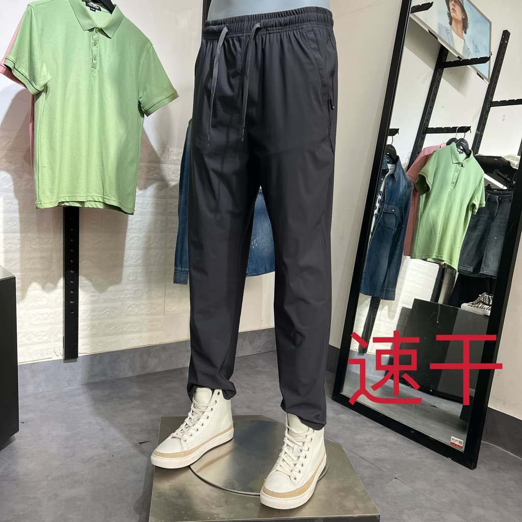 JJ Cut Label Verão Masculino Fino Quatro Lados Elástico Solto Respirável Confortável All-Match Boca Plana Calças Esporti