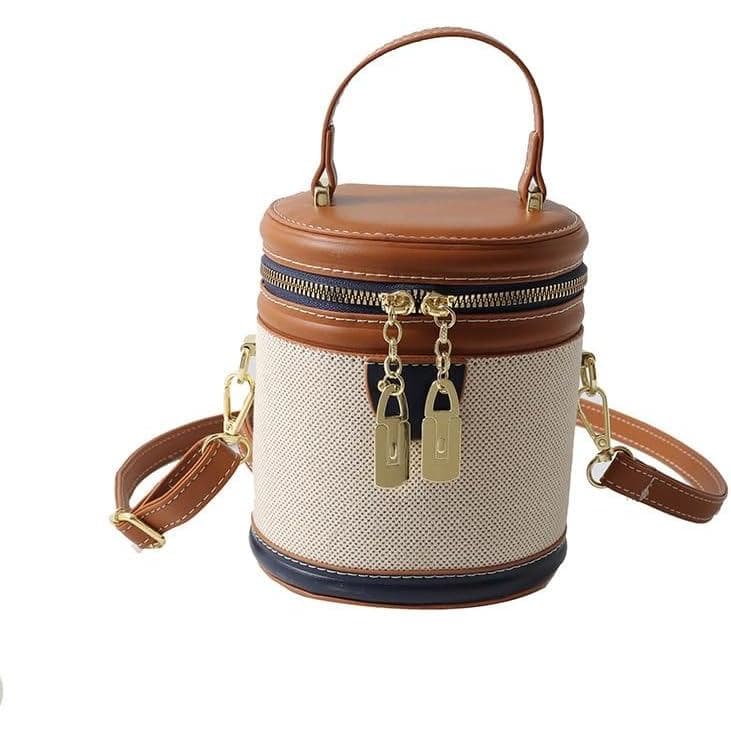 Bolsa vintage com cores contrastantes e vibrantes, carteira cilíndrica com acabamento sofisticado, bolsa transversal de