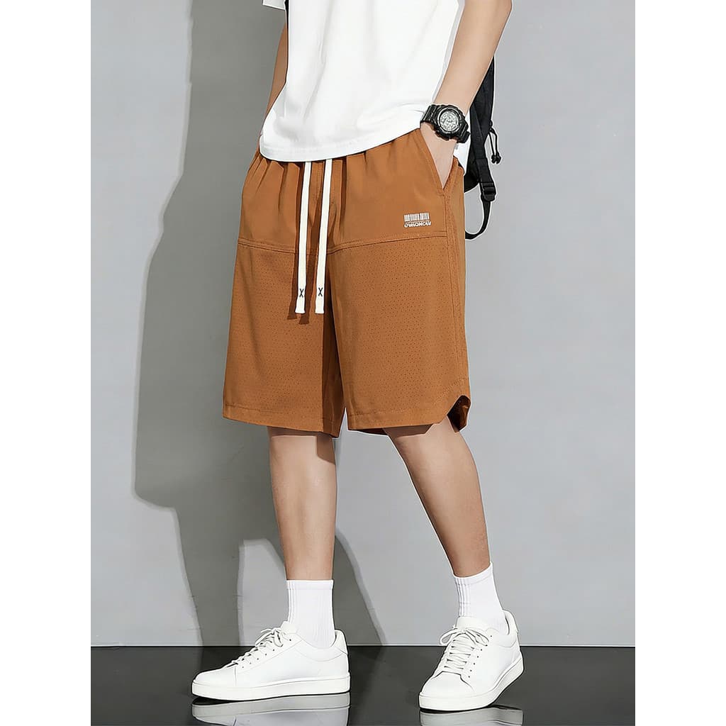 Tamanho grande moda Casual roupas masculinas Design malha perfurada Shorts de secagem rápida calças de praia basquete es